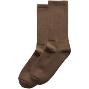 Two pairs of brown socks, featuring a simple design, arranged side by side.