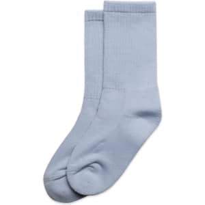 Two pairs of light blue socks, featuring a simple design and ribbed cuffs, displayed together.