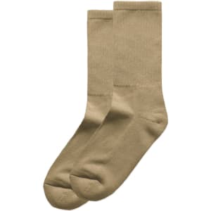 Two pairs of beige socks neatly displayed, featuring a simple and classic design. The image includes a logo.