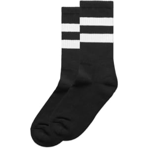 Two pairs of black socks with white stripes, featuring a logo on one sock.