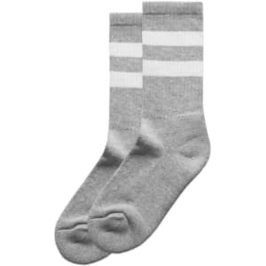 Two pairs of grey socks with white stripes, featuring a simple design and a branding logo.