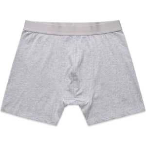 Grey boxer shorts featuring an elastic waistband and a simple design. The product includes branding on the waistband.