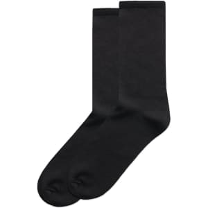 A pair of black business socks, featuring a plain design and a logo on the upper section.