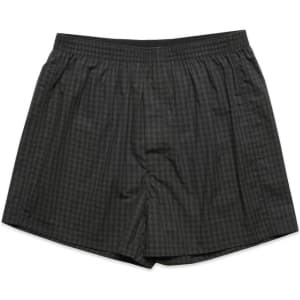 Boxer shorts in a grey check pattern featuring an elastic waistband and side pockets. Includes a logo.