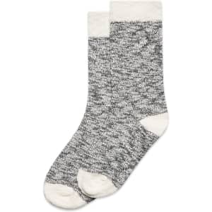 A pair of grey slub socks with light cream cuffs and toes, featuring a textured design.