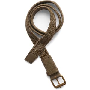 A woven mesh belt in a tan colour with a brown buckle and leather accents. It features a logo on the buckle.