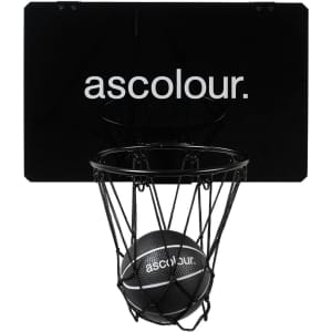 A mini basketball set featuring a black backboard, net, and a black basketball, with a logo on the backboard.