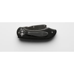A black and silver utility knife with a folding design and a metallic finish, featuring a logo.