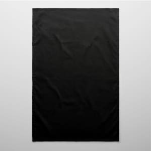 A black tea towel with a plain design. It has a subtle texture and includes a logo.