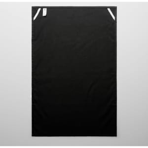 A black tea towel featuring white accents and a small tag. Suitable for home and kitchen use.