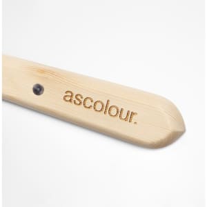 A wooden palette knife with a rounded end and a branding logo on the handle.