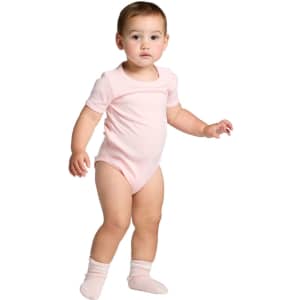 A pink organic infant one-piece with short sleeves, featuring a snug fit and paired with light pink socks.