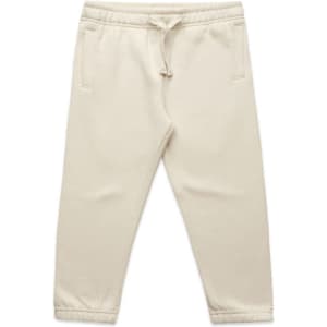Cream-coloured kids' track pants featuring an elasticated waistband and side pockets. The pants have a logo detail.