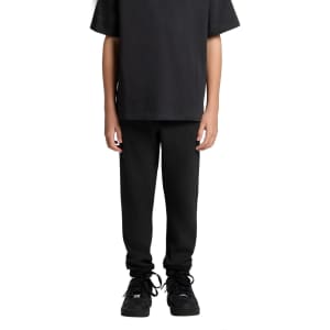 Black track pants displayed on a person wearing a matching black t-shirt and shoes, featuring a logo.