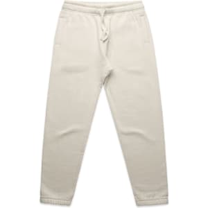 Cream track pants featuring an elastic waistband and side pockets. The pants have a simple design with a logo detail.