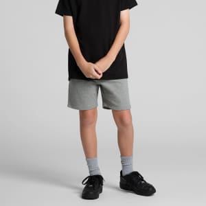 Grey youth stadium shorts with an elastic waistband, styled with a black t-shirt and black sneakers.