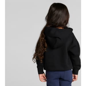 A black hoodie with a hood, worn by a child with long hair, facing away from the camera.
