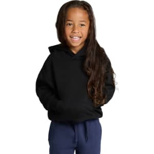 A child in a black hoodie smiles, featuring a kangaroo pocket and a relaxed fit, paired with navy pants.
