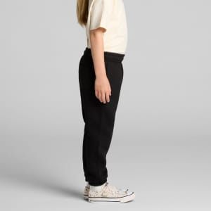Black track pants for youth, featuring an elastic waistband and side pockets, showcased on a child.