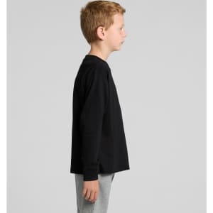 A black long-sleeve t-shirt displayed on a model facing sideways, paired with grey pants. It features a logo.