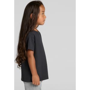 A black kids' heavy faded tee displayed on a child with long hair, set against a plain background.