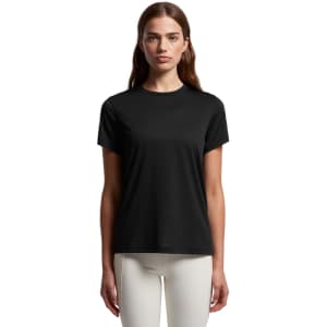 A black active tee featuring a logo, displayed on a model with long hair and neutral background.