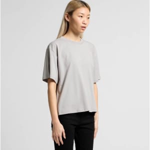 A grey t-shirt with a relaxed fit and short sleeves, featuring a logo on the garment.