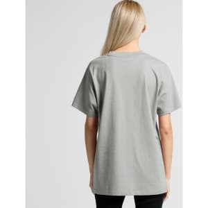 A relaxed-fit t-shirt in a soft green shade, featuring a logo on the back.