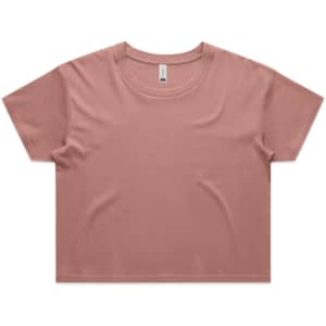 A crop tee in a muted pink colour with a rounded neckline and short sleeves. Features a logo on the label.
