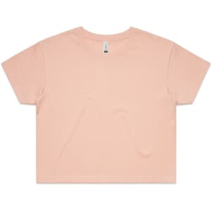 A cropped tee in a soft peach colour with a relaxed fit and short sleeves. It features a branding label.