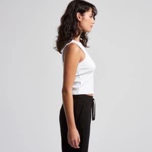 A white organic rib crop tank top displayed on a model, featuring a simple design and fitted style.