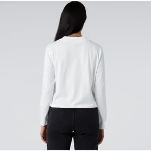 A white long-sleeve tee displayed from the back, featuring a logo on the neckline.