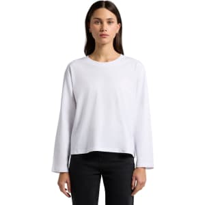A long-sleeve white t-shirt with a relaxed fit displayed on a model against a plain background.