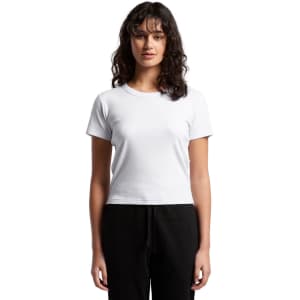A white ribbed baby tee with short sleeves, modelled by a female figure, paired with black trousers.