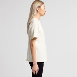 A light cream t-shirt is displayed, featuring a simple design and short sleeves. The shirt has a logo.