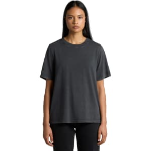 A woman wearing a stone wash heavy tee in charcoal grey, featuring a relaxed fit and short sleeves.