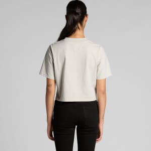 A cropped, faded tee in light grey, displayed from the back, with a plain design and short sleeves.