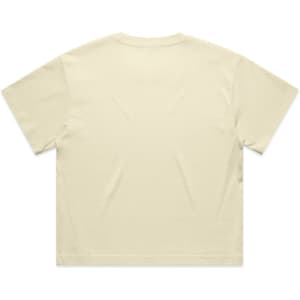 A cropped tee in a soft cream colour with a plain back and short sleeves. It features a logo.