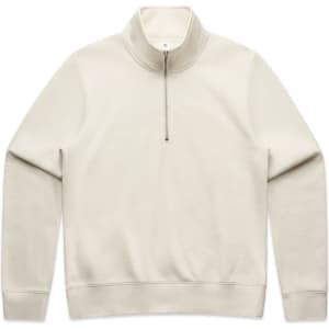 A cream half zip crew jumper with a smooth texture and long sleeves, featuring a logo on the front.