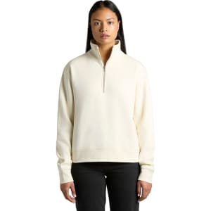 A cream-coloured half zip crew jumper with a relaxed fit and long sleeves, featuring a small logo.
