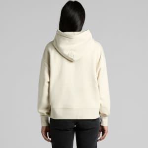 A cream-coloured hoodie with a large hood, featuring a relaxed fit and long sleeves. It has a logo on the back.