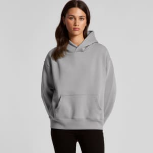 A grey hoodie featuring a front pocket and a hood, worn by a model standing straight, with a logo present.