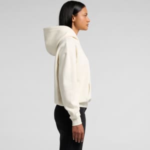 A cream-coloured hoodie with a hood, featuring a loose fit and a front pocket. It has a logo on the garment.