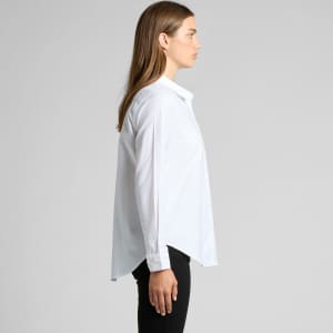 A white button-up shirt with a collar and long sleeves, displayed on a model from the side.