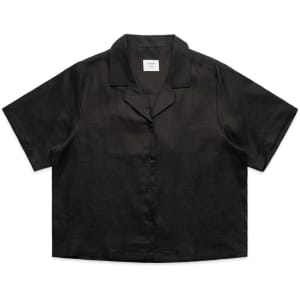 A black short-sleeved button-up shirt with a collar and a front button closure, featuring a logo.