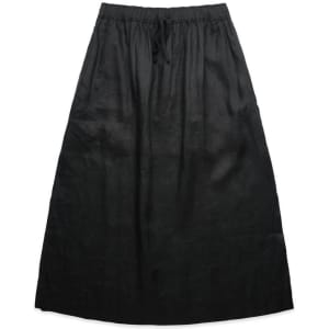 A black linen skirt featuring an elastic waistband and drawstring, displayed flat against a white background.
