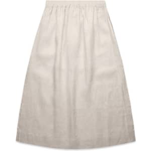 A linen skirt in a neutral beige colour with an elastic waistband. It has a simple and elegant design.