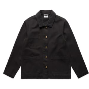 A black canvas chore jacket featuring a collared neckline, front buttons, and multiple pockets. It has a logo on the label.