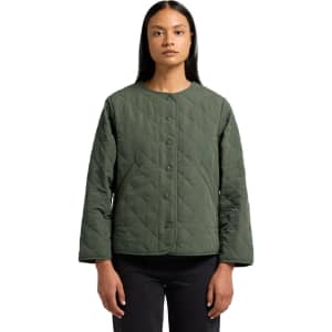 A quilted jacket in dark green with a button closure and long sleeves, featuring a logo on the side.