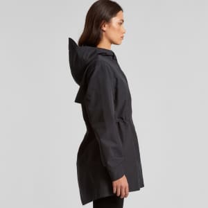 A black soft shell jacket with a hood and cinched waist, featuring a branding logo.